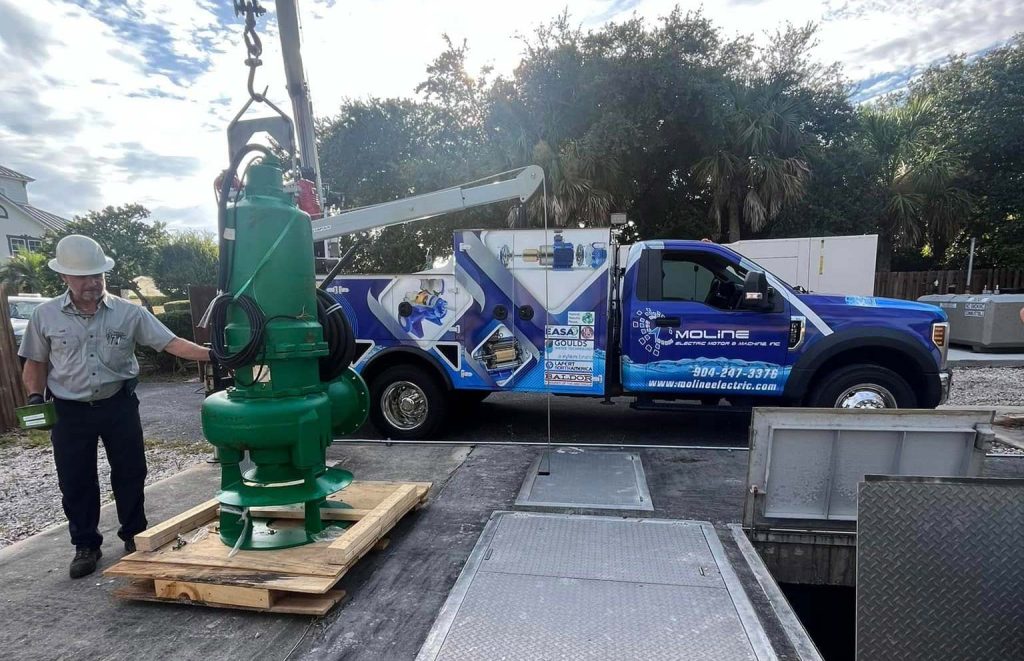 A Hydro Electric Motor Being Lifted For Repair