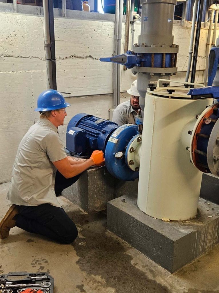 Jobs - Moline Electric Employees Working On a Pump